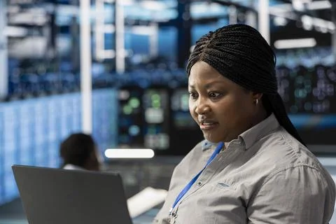 Stressed engineer panicking after seeing errors while overseeing data center Stock Photos