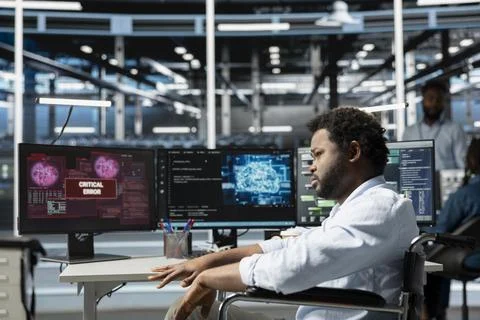 Stressed engineer panicking after seeing errors while overseeing data center Stock Photos