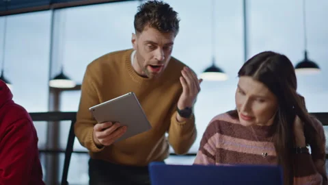 Stressed executive explaining task to office team working at laptops closeup. Stock Footage 340076184