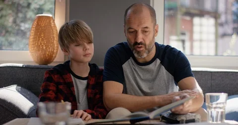 Stressed Father explaining son his homework Video stock 128830134