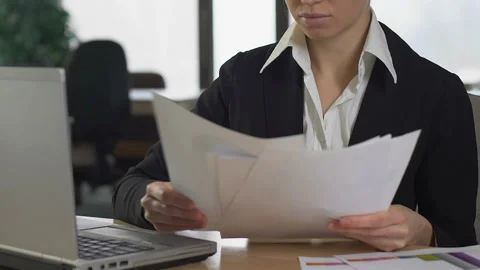 Stressed financial consultant comparing charts documents working office, report Stock Footage 107366265