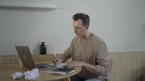 Stressed freelancer creating ideas for project. Adult male lacking inspiration Stock Footage 139593842