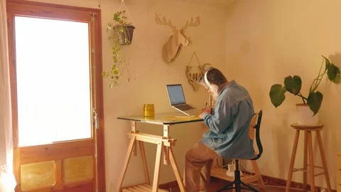 Stressed freelancer working remotely at his home office desk Stock-Footage 331900253