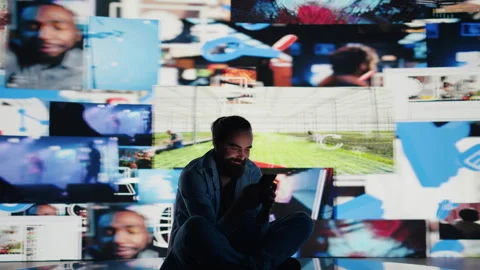 Stressed individual obsessively overuses his mobile phone social apps 库存影片 311084889