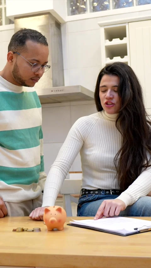Stressed interracial couple arguing over family finances and savings Vídeo Stock 334134189