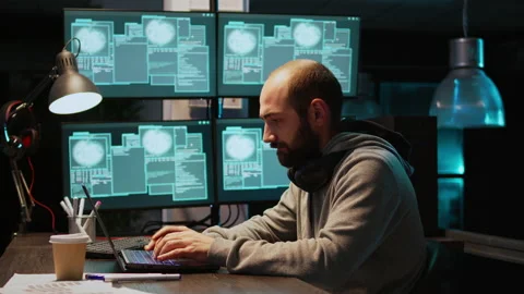 Stressed IT coder hacking security system on computer Stock Footage 222841448