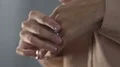 Stressed lady with shaking hands taking off ring, divorce, relations break up HD Footage