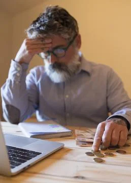 Stressed man calculating expenses facing financial problems 스톡 사진