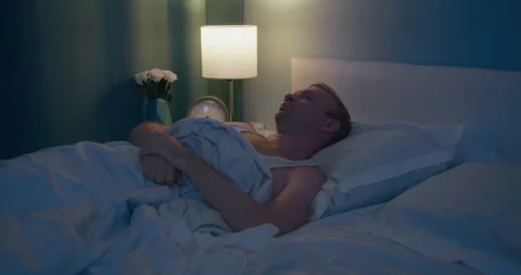 Stressed man cannot sleep due to noise of neighbors Stock Footage 300435534