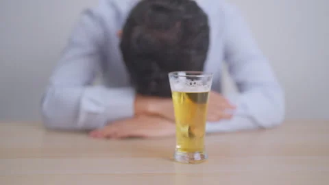 Stressed man drinking beer alone with problem. Exhausted drunk man looking .. Stock Footage 333102844