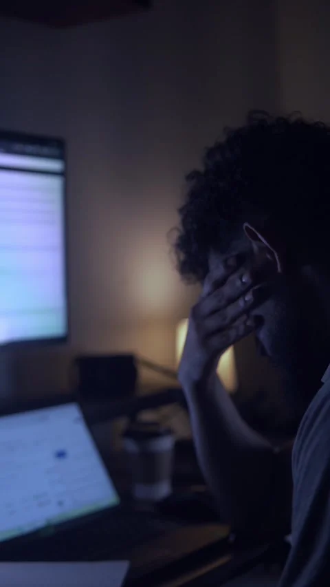Stressed man experiencing burnout working late at night on computer Stock Footage 327307195