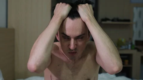 Stressed man experiencing headache and mental breakdown Stock Footage 344279344