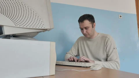 Stressed Man Getting Angry While Working On The Old Computer Stock Footage 126085757