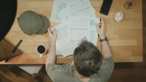 Stressed Man Head in Hands Financial Documents Desk Work Stress Data Analys.. Stock Footage 344088532