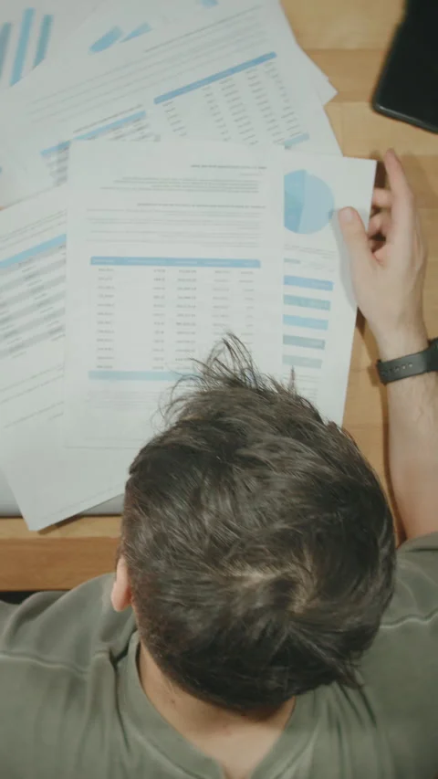 Stressed Man Head in Hands Financial Documents Desk Work Stress Data Analys.. Stock Footage 344499378