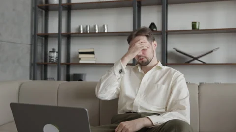 Stressed Man With Laptop Feeling Tired And Overwhelmed By Work Stock Footage 344697035