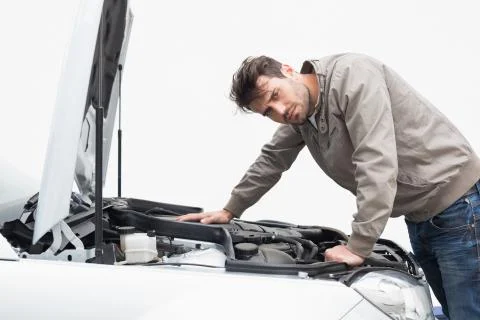 Stressed man looking at engine Stock Photos