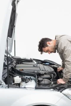 Stressed man looking at engine Stock Photos