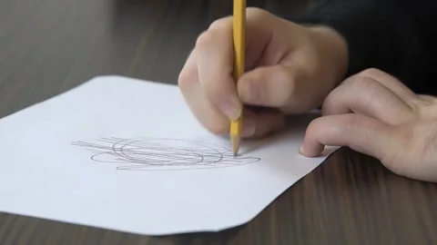 Stressed Man Scribbling using pencil on Paper Stock Footage 152982868