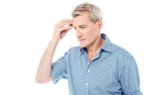 Stressed man suffering from headache Stock Photos