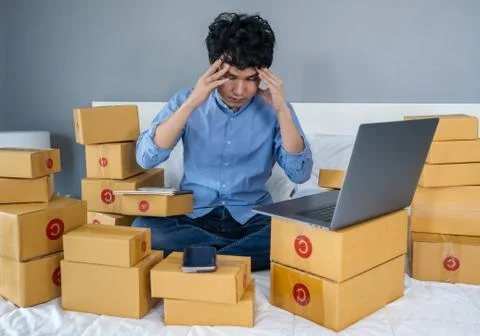 Stressed man using laptop computer and working problem to selling product onl Stock Photos