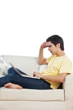 Stressed man using a laptop Fotos Stock