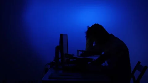 Stressed man working on computer at night Stock Footage 318980912