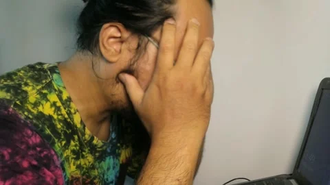 Stressed man working on laptop computer at home office. Stock Footage 339311361