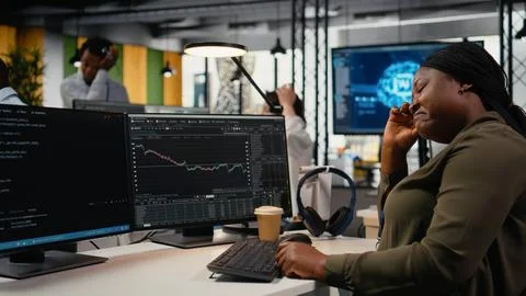 Stressed manager in AI tech startup office upset by crashing asset value Stock Photos
