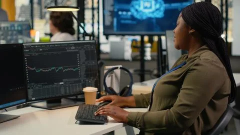 Stressed manager in AI tech startup office upset by crashing asset value Stock Photos