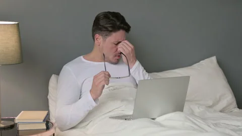 Stressed Middle Aged Man with Headache Sitting in Bed 스톡 동영상 142377860
