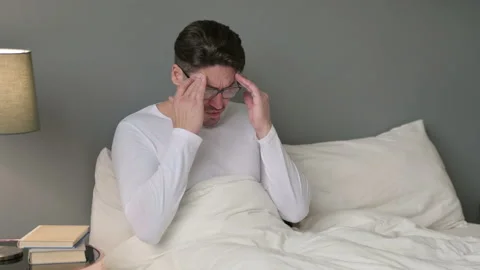 Stressed Middle Aged Man with Headache in Bed 스톡 동영상 142379159
