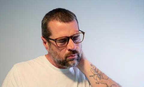 Stressed Middle Aged Man Suffering From Migraine Stock Photos
