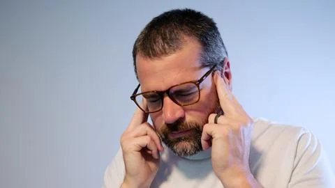 Stressed Middle Aged Man Suffering From Migraine Stock Photos