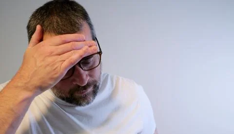 Stressed Middle Aged Man Suffering From Migraine Stock Photos