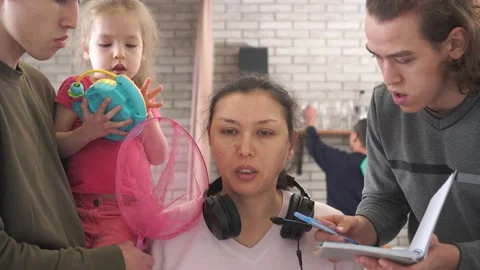 Stressed multitasking mother working at home during the Covid-19 lockdown Stock Footage 151088134