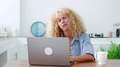Stressed multitasking young Caucasian redhead woman feeling tired and overworked Stock Footage 219547421