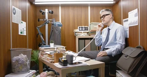 Stressed office worker having a phone call Stock Footage 309020379