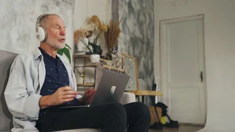Stressed old man freaking out when getting a notice with bad news about being Stock Footage 235270816