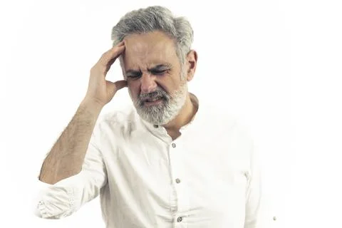 Stressed out middle-aged man headache overworked and exhausted closeup isolated Stock Photos