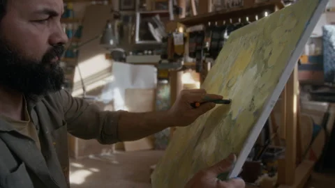 Stressed Painter Drawing Impulsively and Throwing Away Canvas in Despair Stock Footage 334684352