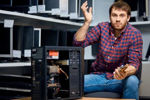 Stressed PC spescalist with broken computer Stock Photos