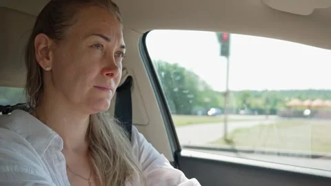 Stressed sad woman crying while driving car Stock Footage 339645551