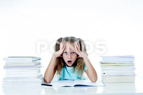 Stressed school girl feeling frustrated and unable to concentrate in her stud Stock Photos