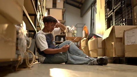 Stressed shop worker feeling pressure while working in a storage area Stock Footage 339642241
