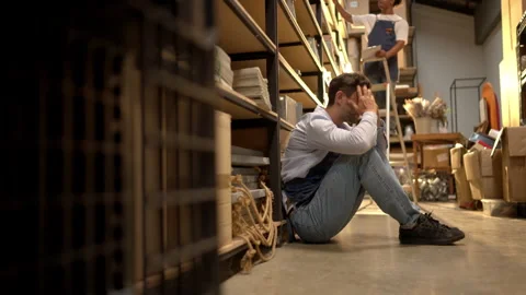 Stressed shop worker feeling pressure while working in a storage area Video stock 339642913