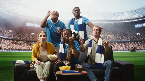 Stressed soccer fans watch dramatic match at home during immersive broadcast Video stock 338179036
