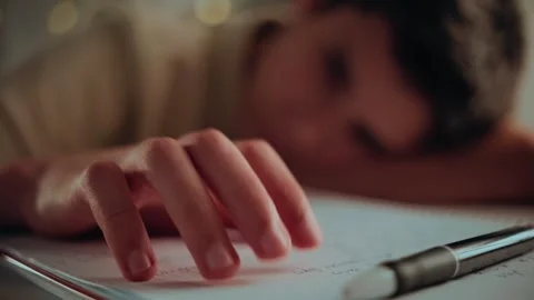 Stressed Student Tapping Fingers on Notebook While Doing Homework Stock Footage 336388653