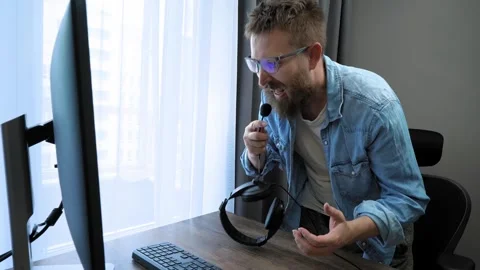 Stressed support agent loses temper during customer call. Burnout at work. Stock Footage 301556813