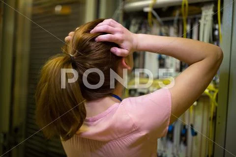Stressed Technician Working On Broken Server